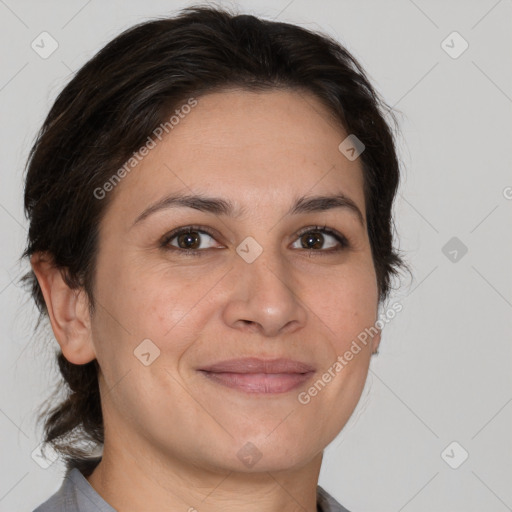 Joyful white adult female with short  brown hair and brown eyes