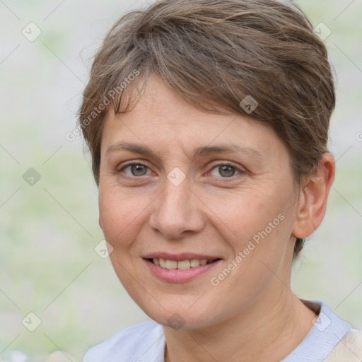 Joyful white adult female with short  brown hair and brown eyes