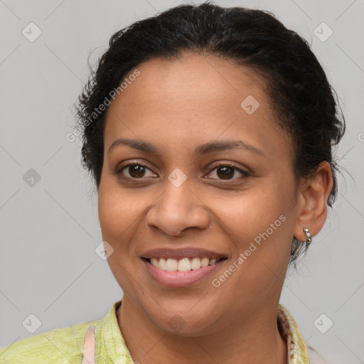 Joyful latino young-adult female with medium  brown hair and brown eyes