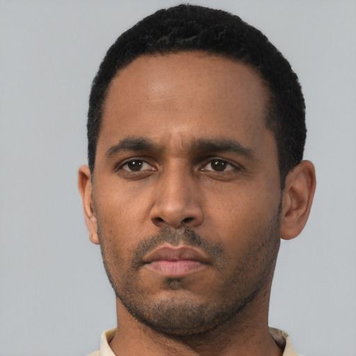 Neutral black young-adult male with short  black hair and brown eyes
