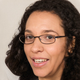 Joyful white adult female with long  brown hair and brown eyes