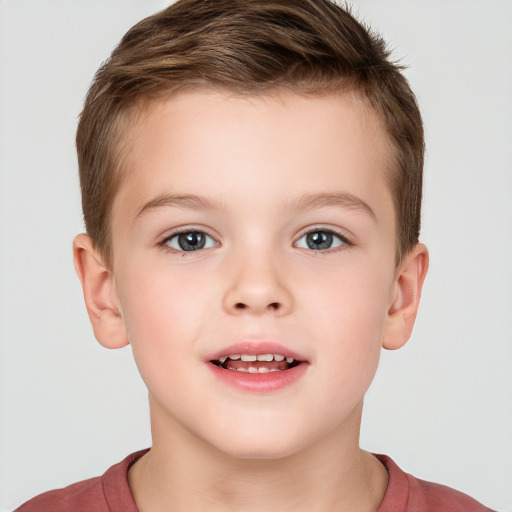 Joyful white child male with short  brown hair and brown eyes