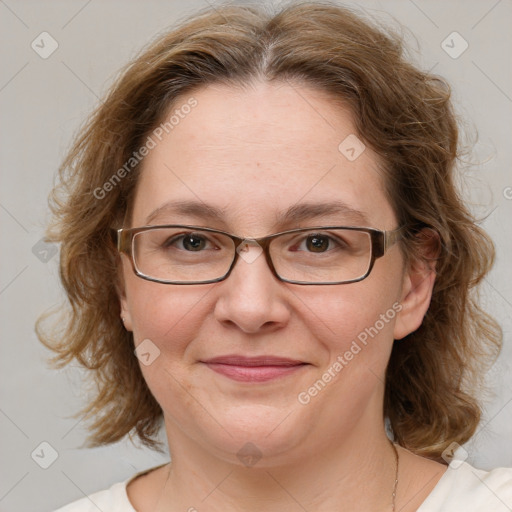 Joyful white adult female with medium  brown hair and green eyes