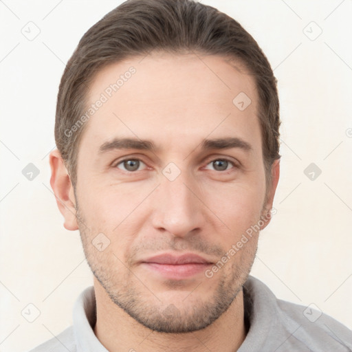 Joyful white young-adult male with short  brown hair and brown eyes