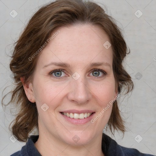 Joyful white adult female with medium  brown hair and blue eyes