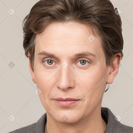 Joyful white adult male with short  brown hair and grey eyes