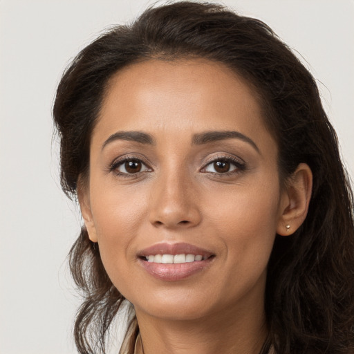 Joyful white young-adult female with long  brown hair and brown eyes