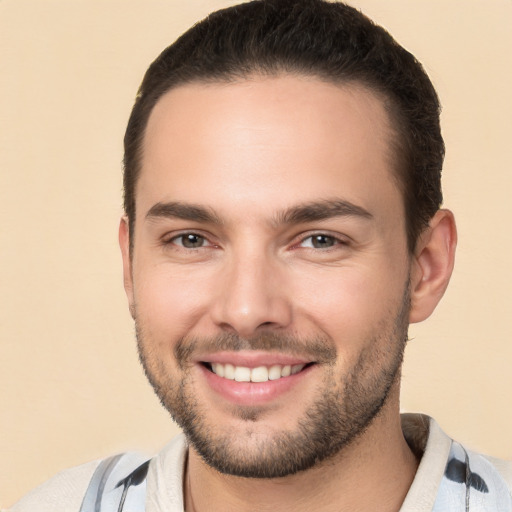 Joyful white young-adult male with short  brown hair and brown eyes