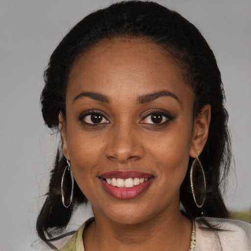 Joyful black young-adult female with medium  black hair and brown eyes