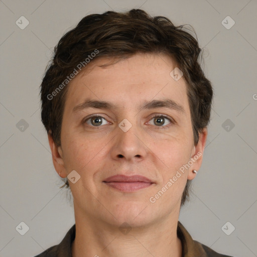 Joyful white adult male with short  brown hair and grey eyes