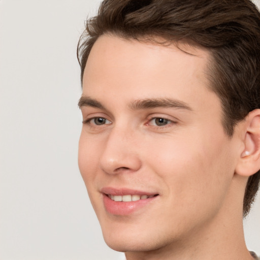 Joyful white young-adult male with medium  brown hair and brown eyes