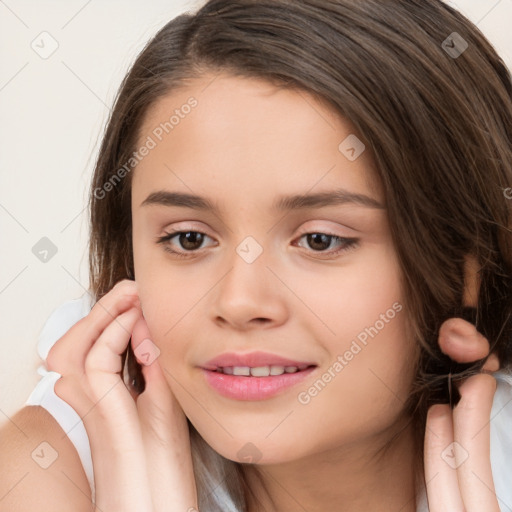 Joyful white child female with long  brown hair and brown eyes