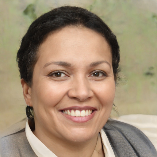 Joyful white adult female with short  brown hair and brown eyes