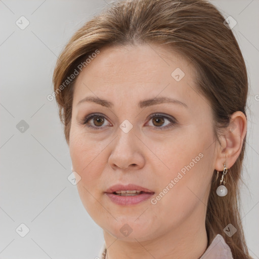 Joyful white adult female with medium  brown hair and brown eyes