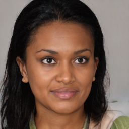 Joyful black young-adult female with medium  brown hair and brown eyes