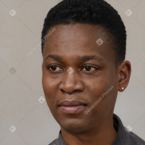 Joyful black young-adult male with short  black hair and brown eyes