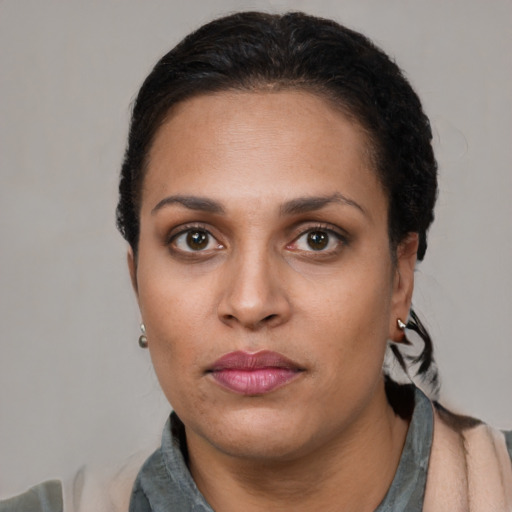 Neutral latino young-adult female with short  black hair and brown eyes