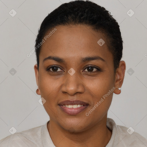 Joyful black young-adult female with short  black hair and brown eyes