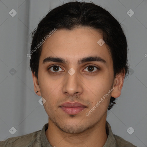 Neutral latino young-adult male with short  brown hair and brown eyes