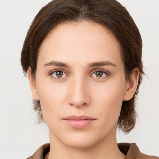 Neutral white young-adult female with medium  brown hair and brown eyes