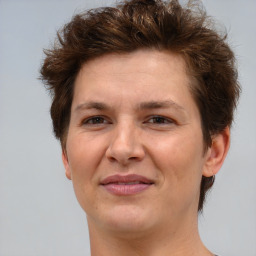 Joyful white adult female with short  brown hair and brown eyes