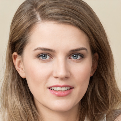 Joyful white young-adult female with long  brown hair and grey eyes