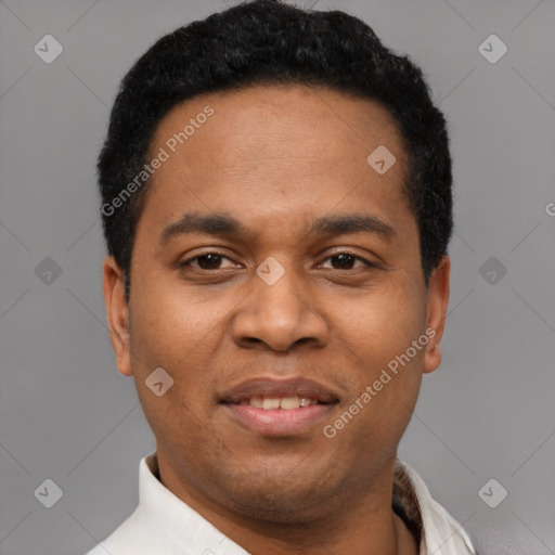Joyful latino young-adult male with short  black hair and brown eyes