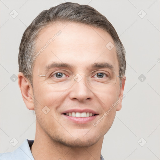 Joyful white adult male with short  brown hair and grey eyes