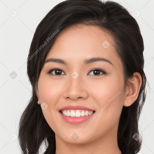 Joyful white young-adult female with long  brown hair and brown eyes