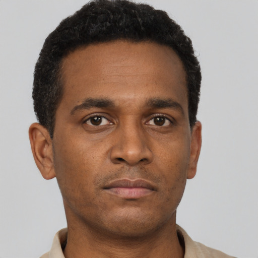 Neutral black young-adult male with short  brown hair and brown eyes