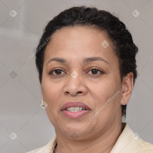 Joyful latino adult female with short  brown hair and brown eyes