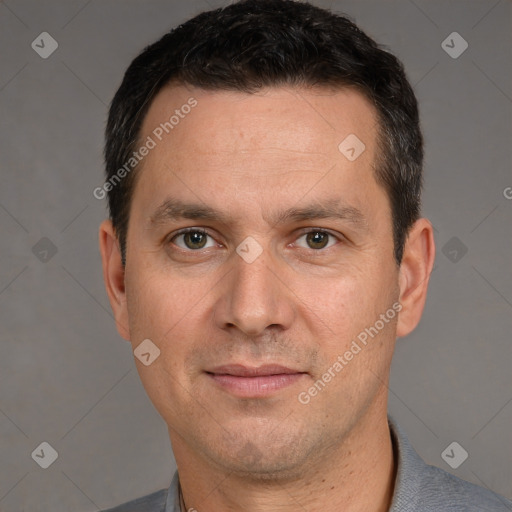 Joyful white adult male with short  brown hair and brown eyes