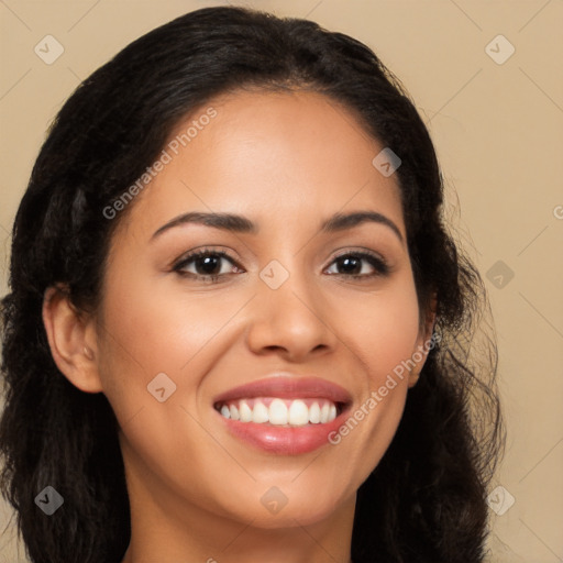 Joyful latino young-adult female with long  brown hair and brown eyes