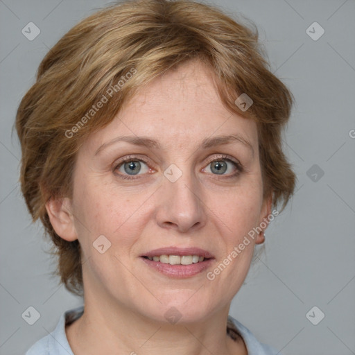 Joyful white adult female with medium  brown hair and blue eyes