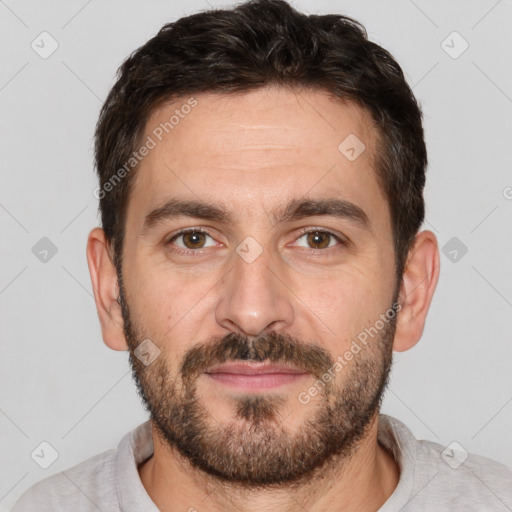 Joyful white adult male with short  brown hair and brown eyes