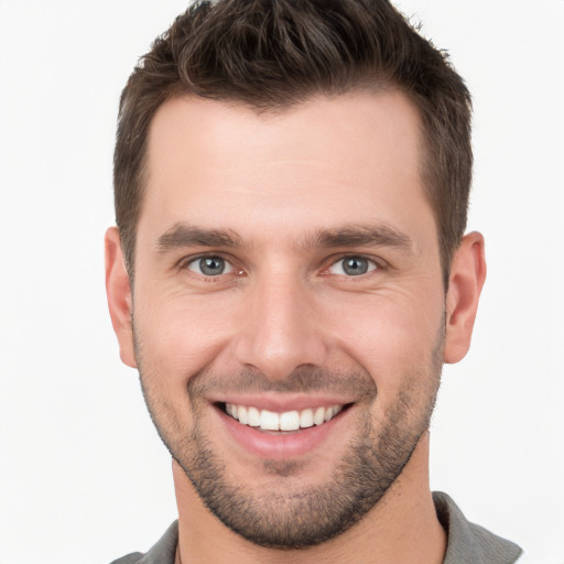 Joyful white young-adult male with short  brown hair and brown eyes