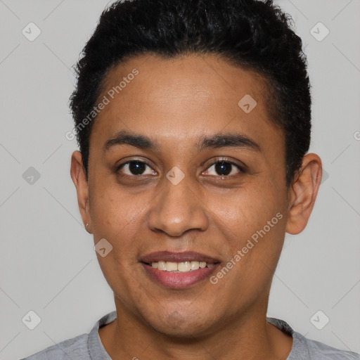 Joyful latino young-adult male with short  black hair and brown eyes