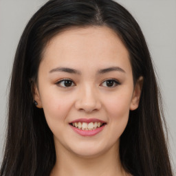 Joyful asian young-adult female with long  brown hair and brown eyes