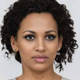 Neutral black young-adult female with short  brown hair and brown eyes