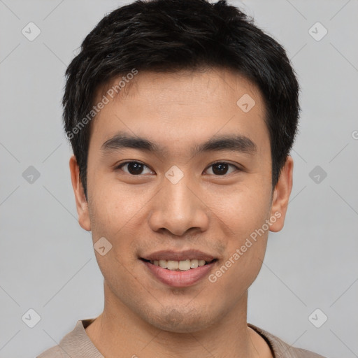 Joyful asian young-adult male with short  brown hair and brown eyes