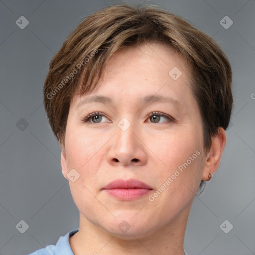 Joyful white adult female with short  brown hair and grey eyes