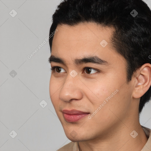 Joyful latino young-adult male with short  black hair and brown eyes