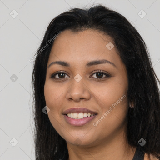 Joyful latino young-adult female with long  brown hair and brown eyes