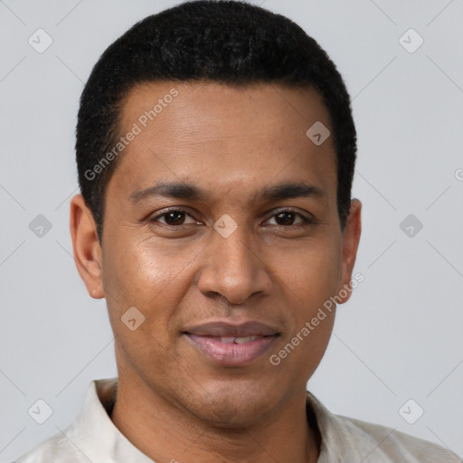 Joyful black young-adult male with short  brown hair and brown eyes
