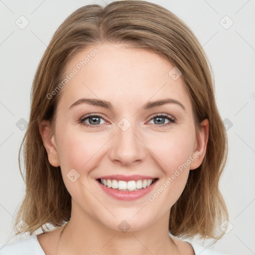 Joyful white young-adult female with medium  brown hair and blue eyes