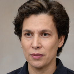 Joyful white adult male with medium  brown hair and brown eyes