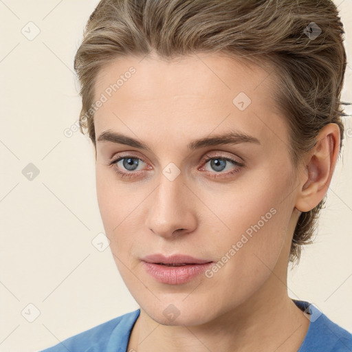 Joyful white young-adult female with medium  brown hair and blue eyes