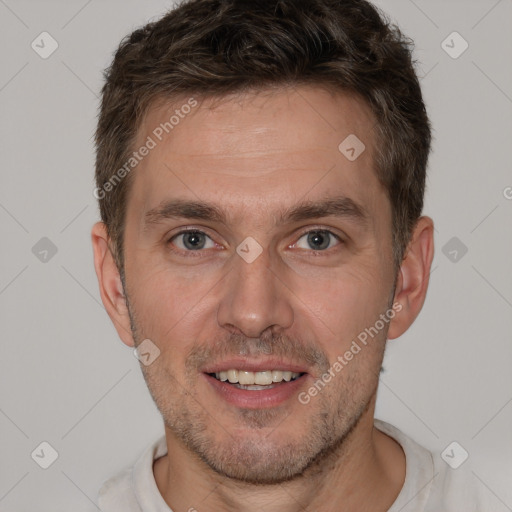 Joyful white adult male with short  brown hair and brown eyes