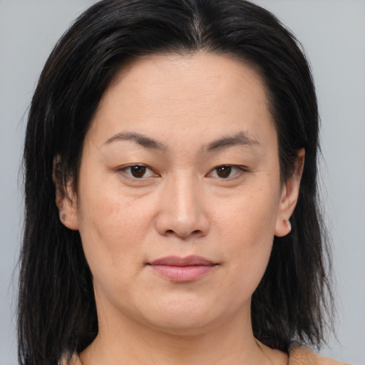 Joyful asian young-adult female with medium  brown hair and brown eyes