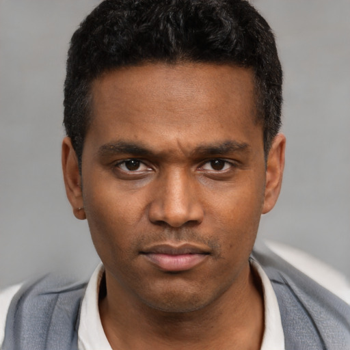 Neutral latino young-adult male with short  black hair and brown eyes
